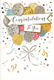 The image shows a refined and joyful congratulations card, its artwork capturing the spirit of a celebration in mid-air. A cluster of balloons takes centre stage, layered in front of one another so that their rounded shapes form a full, balanced composition. The colours range from shimmering gold and polished silver to soft champagne, airy sky blue, blush pink, and gentle grey, each balloon decorated with its own treatment of twinkling stars, slender glitter lines, or lightly scattered metallic dots. They appear softly illuminated, like reflections from London shopfronts on an early evening walk through Covent Garden. From the bottom of each balloon, thin ribbons trail downward in curling strokes of gold and silver, looping gracefully across the lower part of the card, reminiscent of the decorative touches added to a bouquet just before it leaves the flower studio for delivery. A smooth, ribbon-like banner floats across the middle, carrying the words Congratulations To You written in flowing calligraphy that feels warm, sincere, and just formal enough for important milestones. Around the central design, tiny stars and confetti-like speckles drift across a light, almost creamy background, adding gentle movement and sparkle without overwhelming the eye. The overall impression is one of lightness, pride, and celebratory elegance, making the card a natural companion to fresh flowers sent anywhere in London-perhaps to commend a promotion near London Bridge, celebrate exam success in Camden, or mark a special achievement in Clapham. Every element works together to convey joy and admiration with a subtle, contemporary charm.